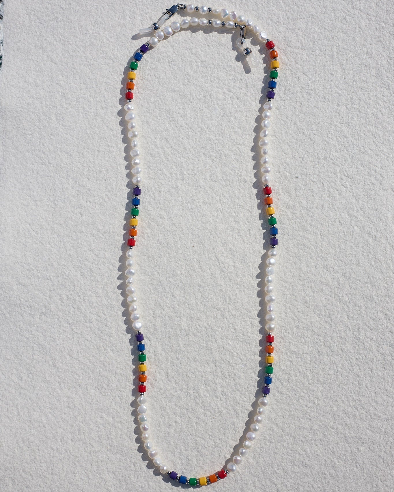 Colorful beaded freshwater necklace on a white background
